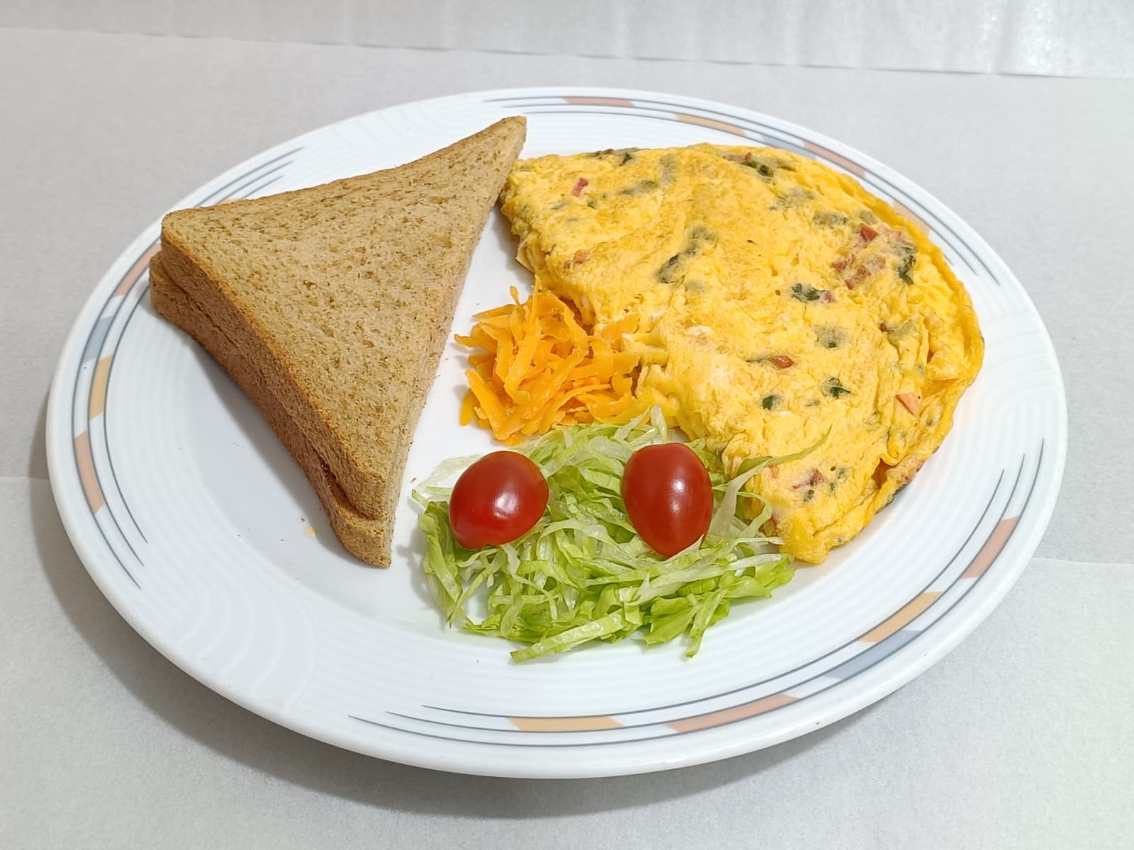 Tomato And Cheese Omelette With Brown Bread